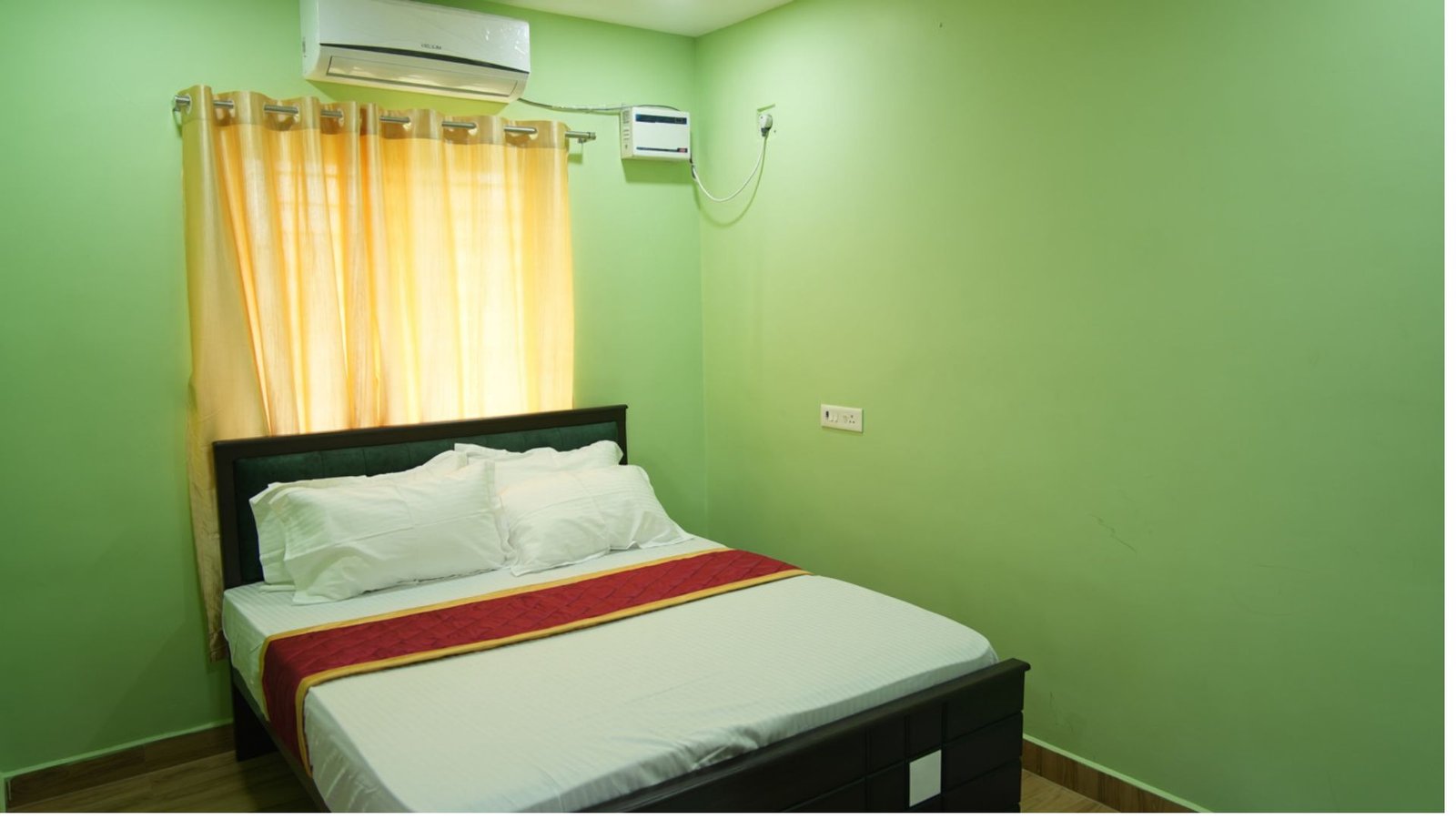 Green-walled bedroom