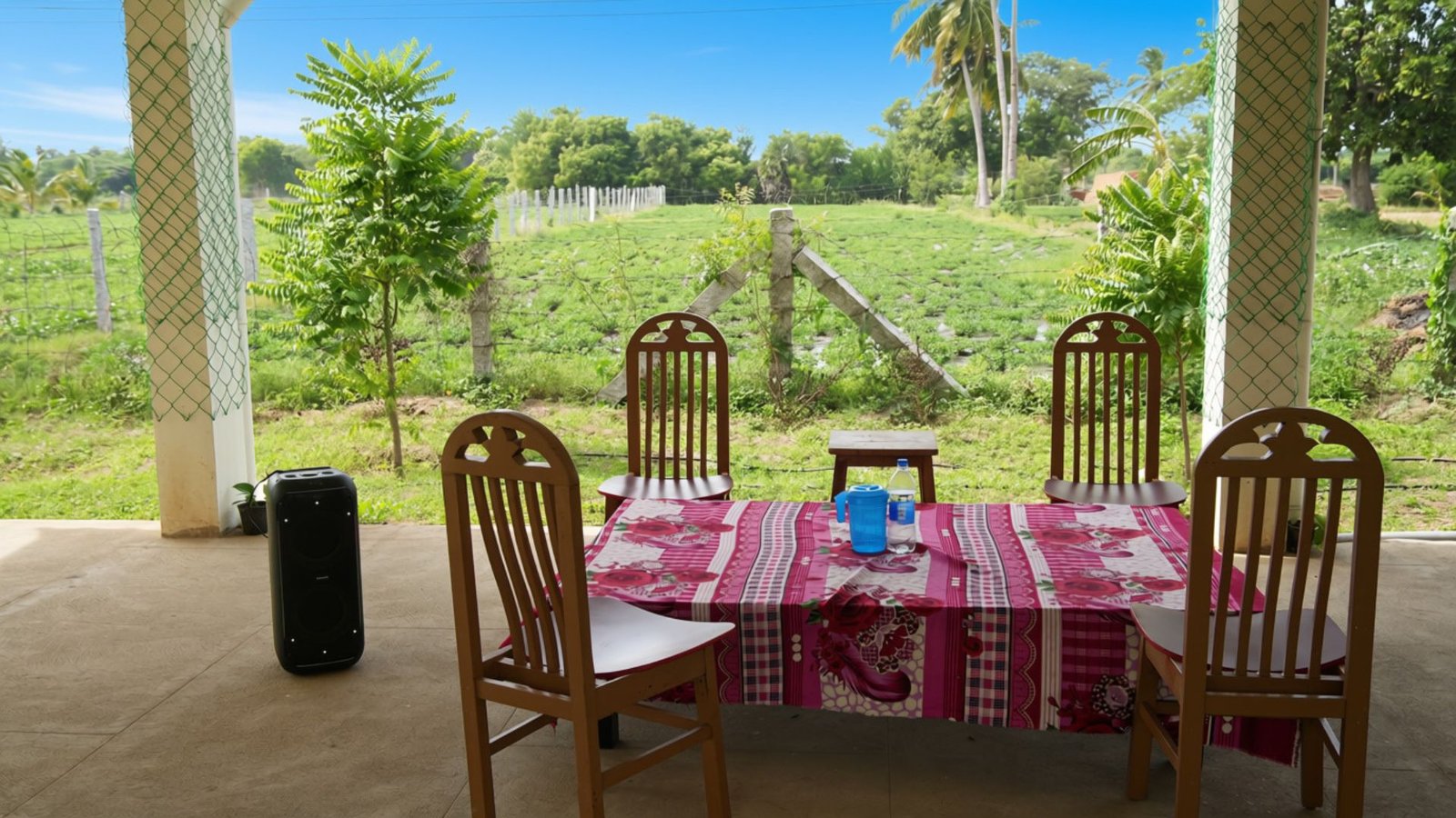 Veranda dining table facing the fields